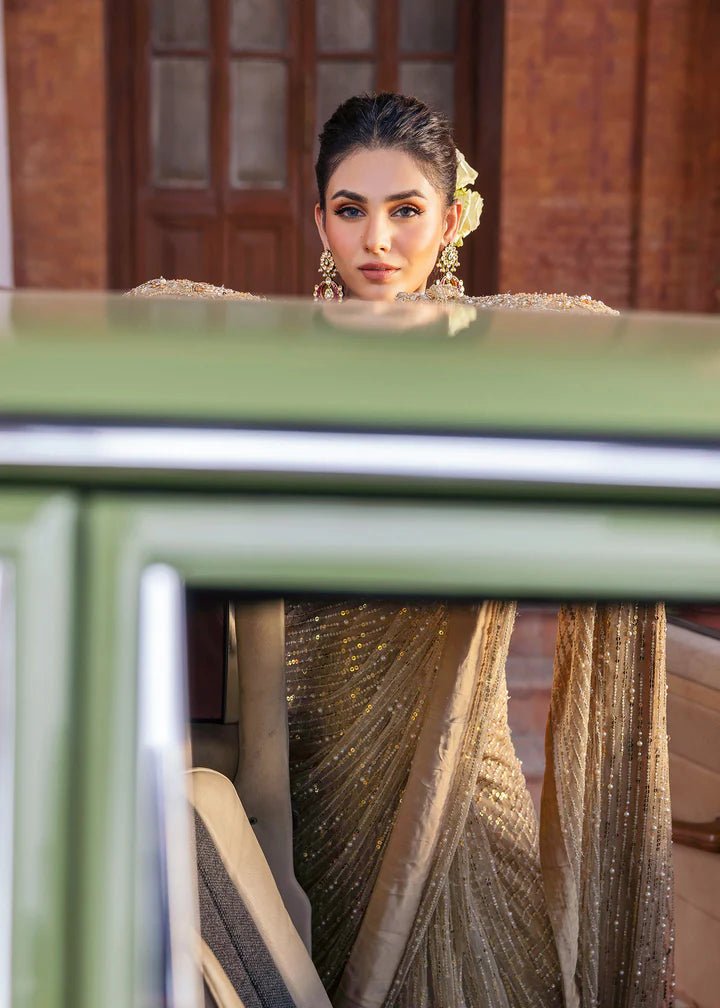 Model wearing Kanwal Malik Raaniyan Luxury Formals Mehrunisa dress in gold, Pakistani bridal clothes online in UK.