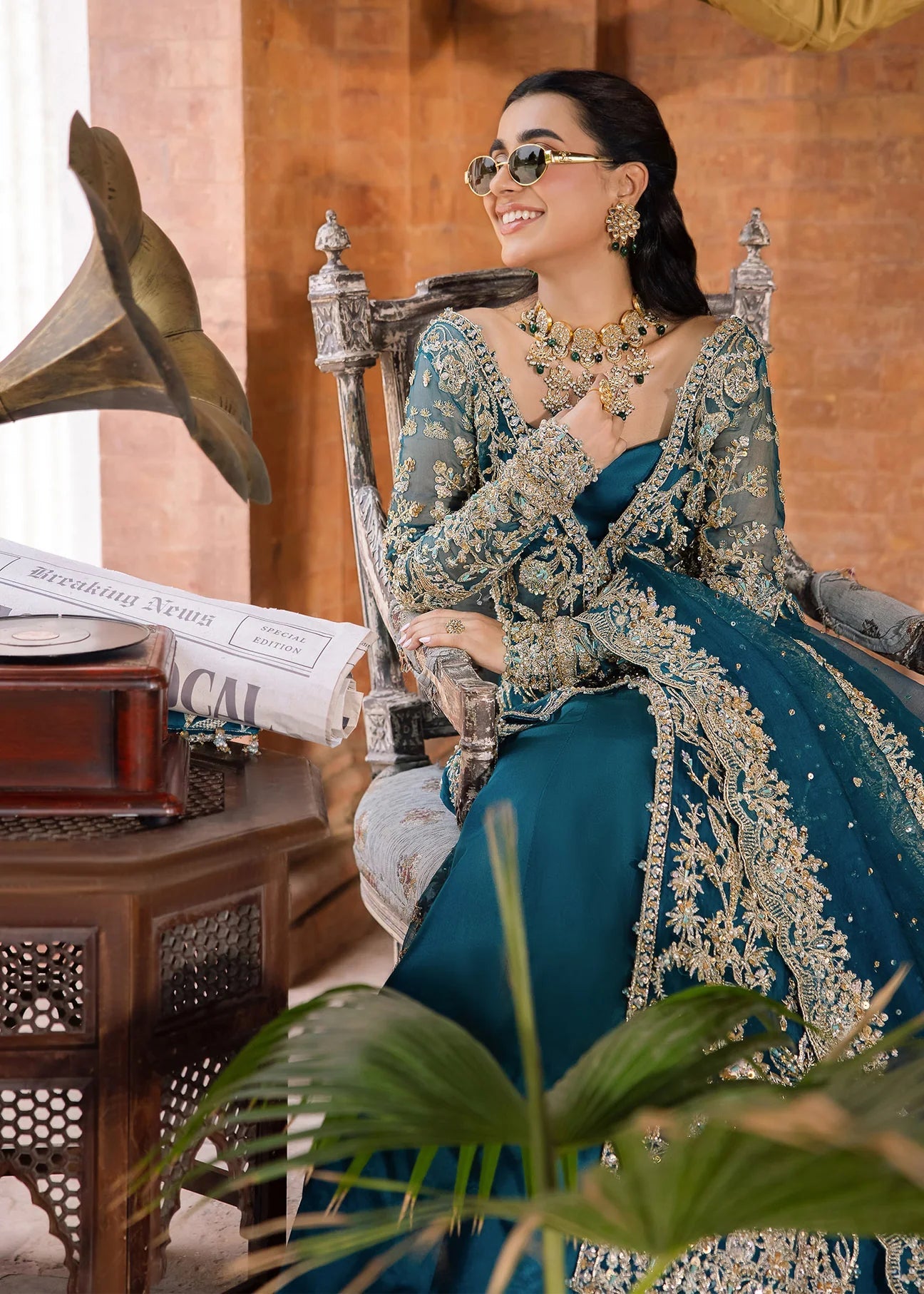 Model wearing Kanwal Malik Raaniyan Luxury Formals Rubab dress in teal, Pakistani bridal clothes online in UK.