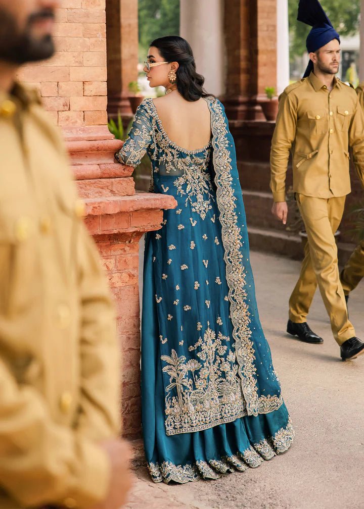 Model wearing Kanwal Malik Raaniyan Luxury Formals Rubab dress in teal, Pakistani bridal clothes online in UK.