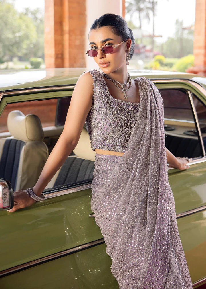 Model wearing Kanwal Malik Raaniyan Luxury Formals Saira dress in silver, Pakistani bridal clothes online in UK.