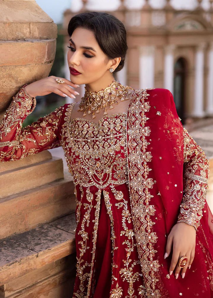 Model wearing Kanwal Malik Raaniyan Luxury Formals Zarbaft dress in deep red, Pakistani bridal clothes online in UK.