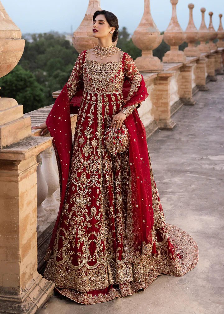 Model wearing Kanwal Malik Raaniyan Luxury Formals Zarbaft dress in deep red, Pakistani bridal clothes online in UK.