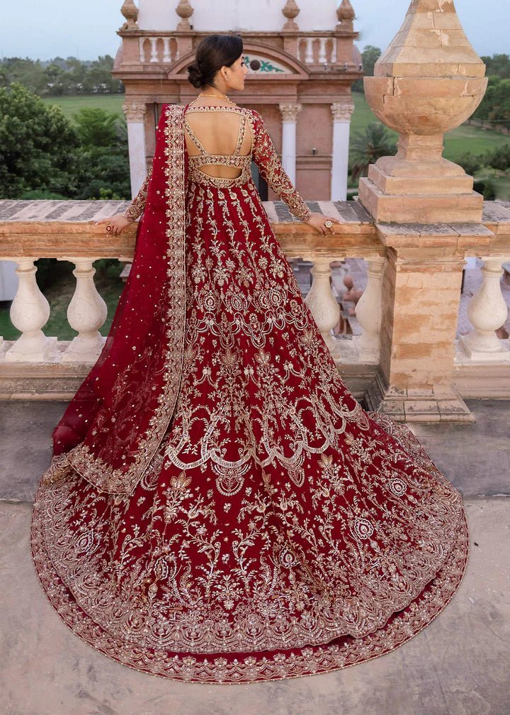 Model wearing Kanwal Malik Raaniyan Luxury Formals Zarbaft dress in deep red, Pakistani bridal clothes online in UK.