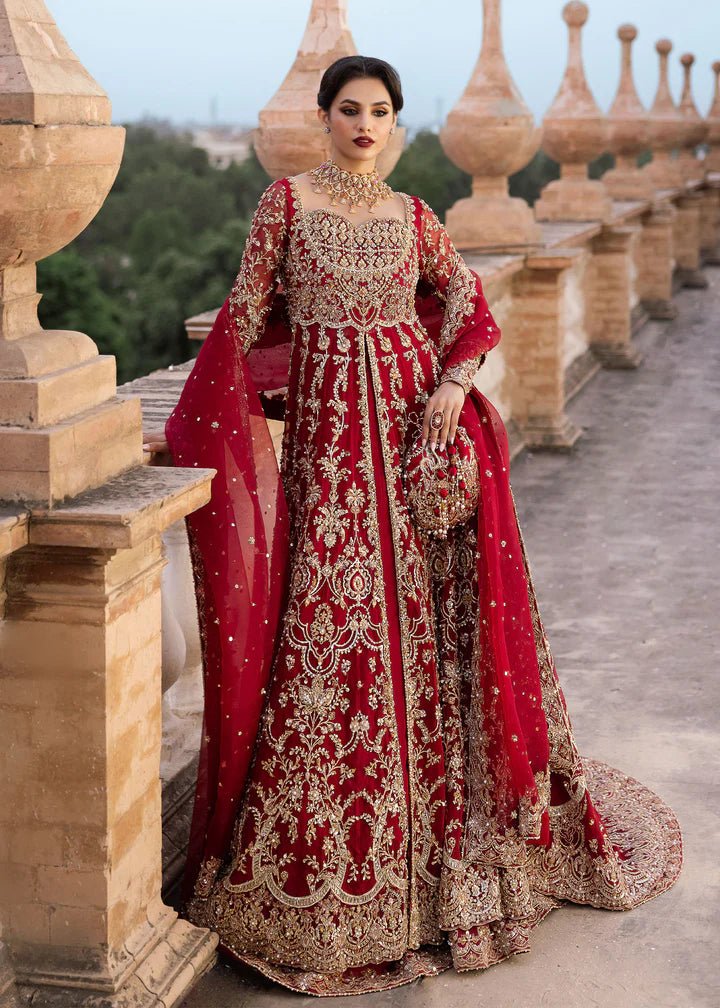 Model wearing Kanwal Malik Raaniyan Luxury Formals Zarbaft dress in deep red, Pakistani bridal clothes online in UK.