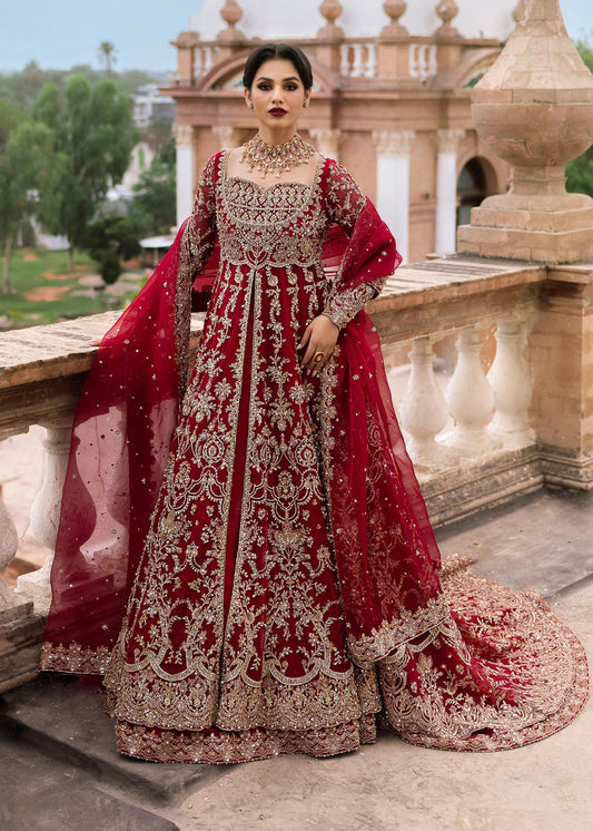 Model wearing Kanwal Malik Raaniyan Luxury Formals Zarbaft dress in deep red, Pakistani bridal clothes online in UK.