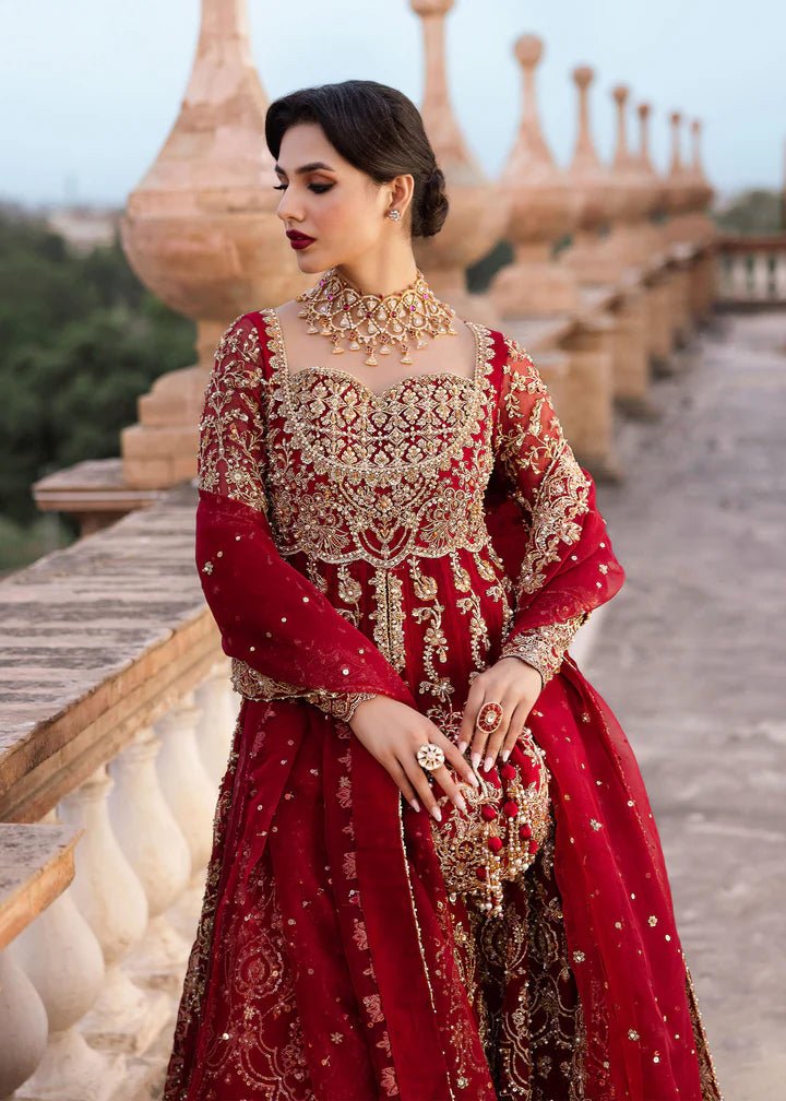 Model wearing Kanwal Malik Raaniyan Luxury Formals Zarbaft dress in deep red, Pakistani bridal clothes online in UK.