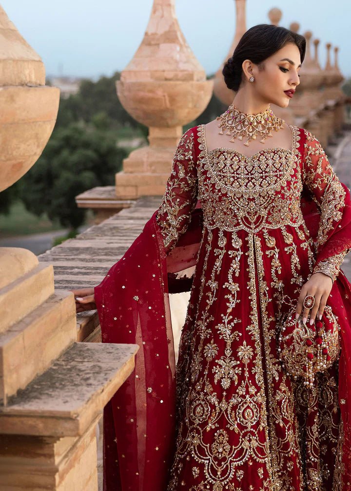 Model wearing Kanwal Malik Raaniyan Luxury Formals Zarbaft dress in deep red, Pakistani bridal clothes online in UK.