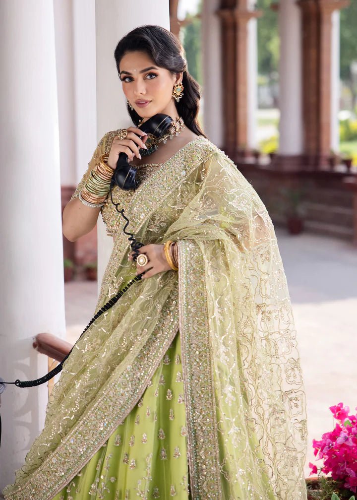 Model wearing Kanwal Malik Raaniyan Luxury Formals Zebaish dress in lime green, Pakistani bridal clothes online in UK.