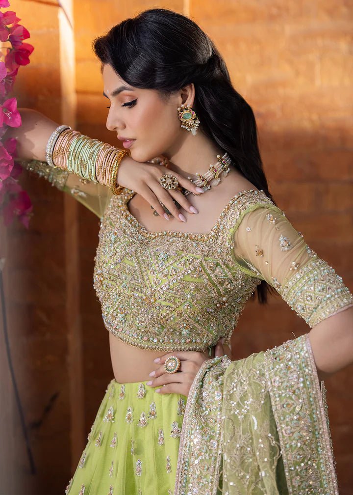 Model wearing Kanwal Malik Raaniyan Luxury Formals Zebaish dress in lime green, Pakistani bridal clothes online in UK.