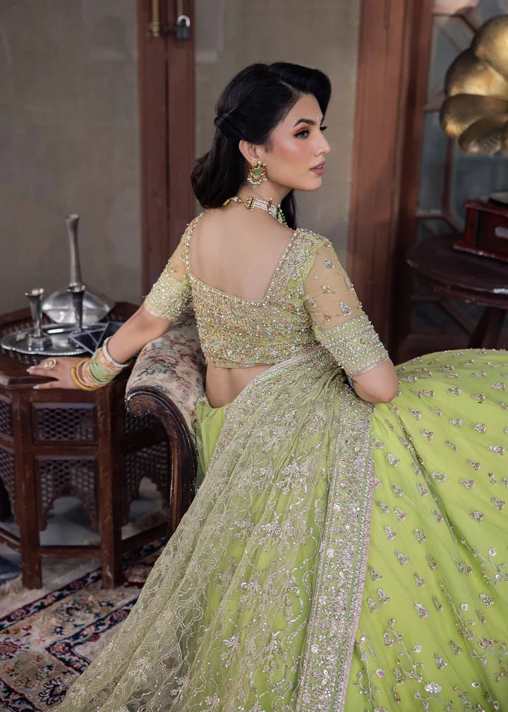 Model wearing Kanwal Malik Raaniyan Luxury Formals Zebaish dress in lime green, Pakistani bridal clothes online in UK.