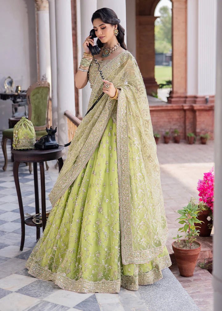 Model wearing Kanwal Malik Raaniyan Luxury Formals Zebaish dress in lime green, Pakistani bridal clothes online in UK.