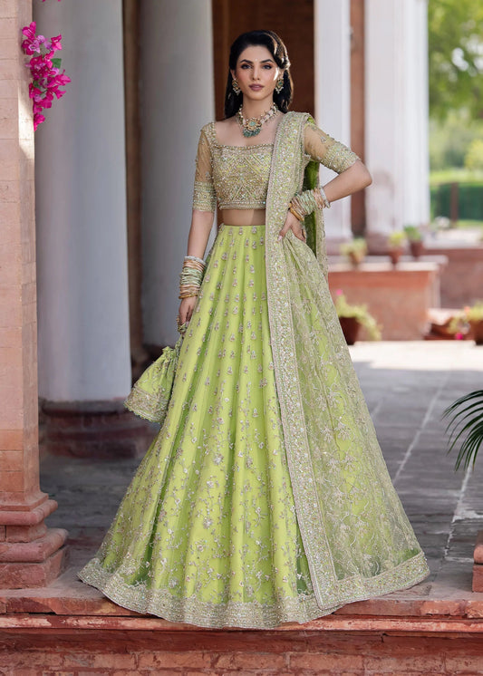 Model wearing Kanwal Malik Raaniyan Luxury Formals Zebaish dress in lime green, Pakistani bridal clothes online in UK.