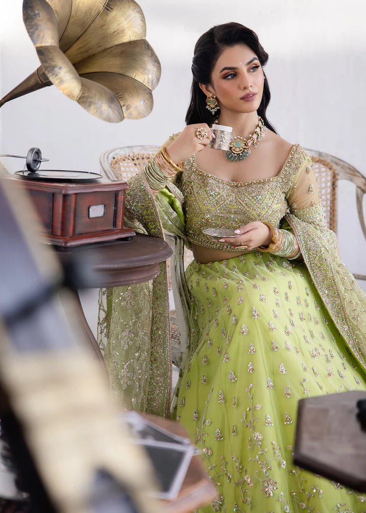 Model wearing Kanwal Malik Raaniyan Luxury Formals Zebaish dress in lime green, Pakistani bridal clothes online in UK.