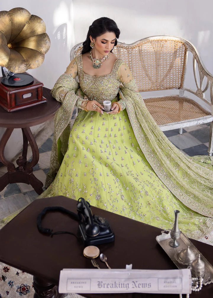 Model wearing Kanwal Malik Raaniyan Luxury Formals Zebaish dress in lime green, Pakistani bridal clothes online in UK.