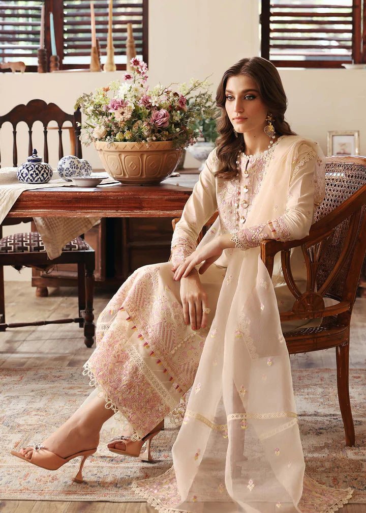 Model wearing Kanwal Malik Raha Casual Pret '24 Amelia dress in beige, showcasing Pakistani lawn suits online in the UK.