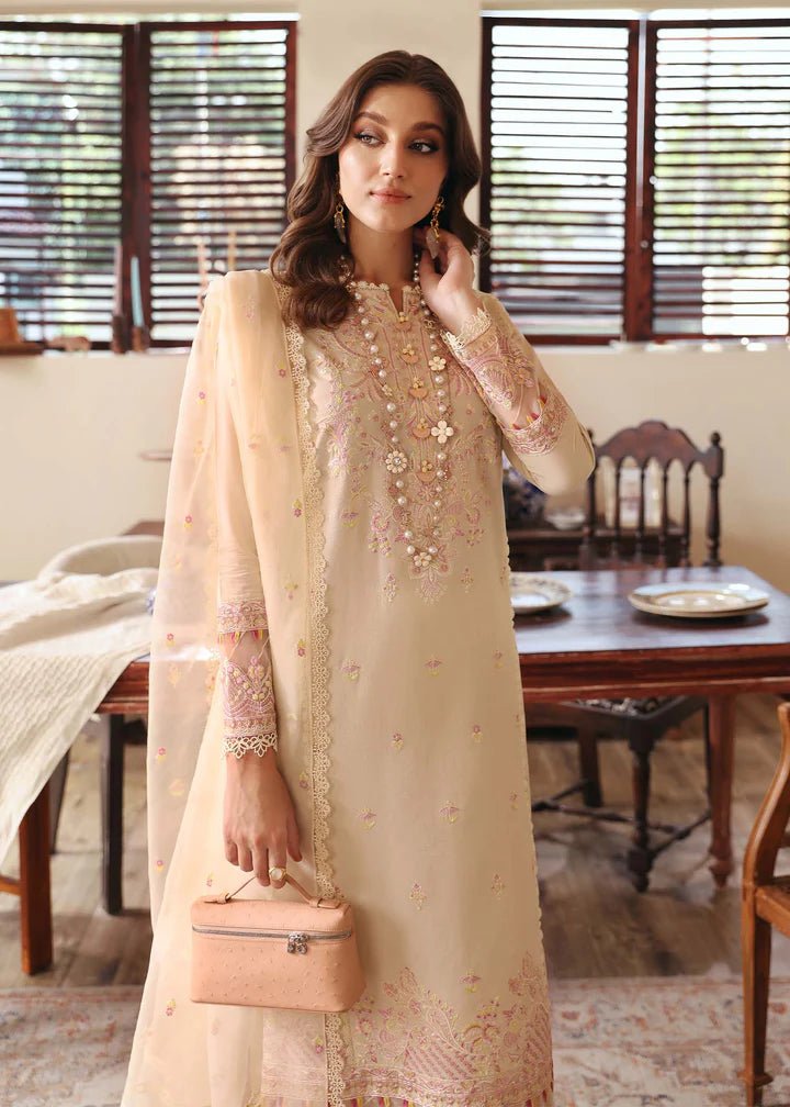 Model wearing Kanwal Malik Raha Casual Pret '24 Amelia dress in beige, showcasing Pakistani lawn suits online in the UK.