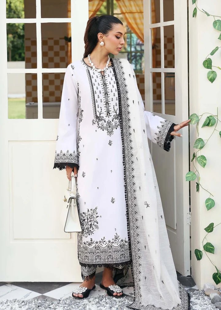 Model wearing Kanwal Malik Raha Casual Pret '24 Celine dress in white, showcasing Pakistani lawn suits online in the UK.