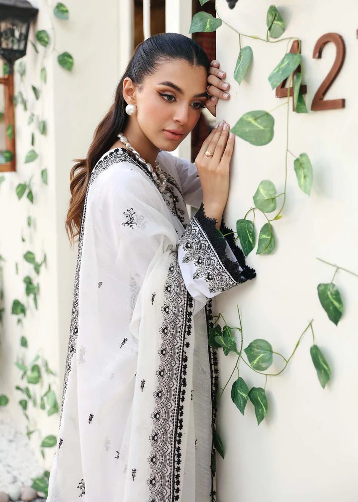 Model wearing Kanwal Malik Raha Casual Pret '24 Celine dress in white, showcasing Pakistani lawn suits online in the UK.