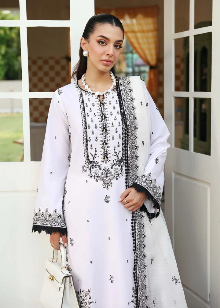 Model wearing Kanwal Malik Raha Casual Pret '24 Celine dress in white, showcasing Pakistani lawn suits online in the UK.