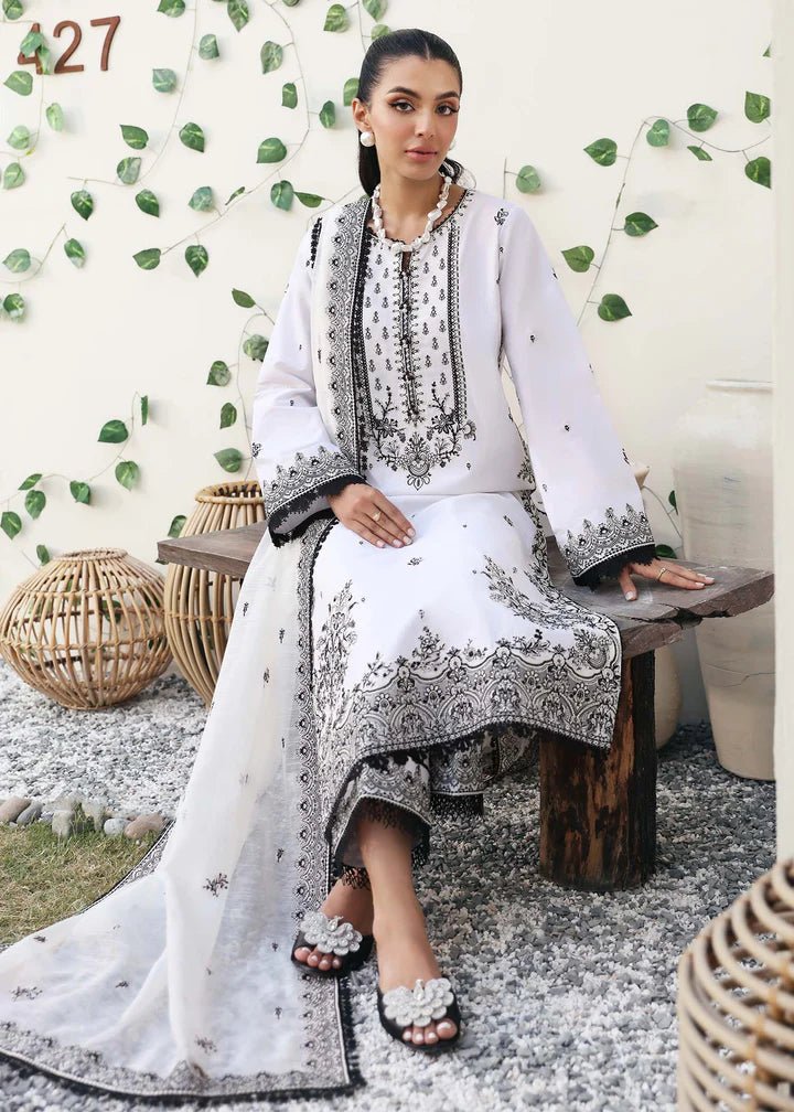 Model wearing Kanwal Malik Raha Casual Pret '24 Celine dress in white, showcasing Pakistani lawn suits online in the UK.