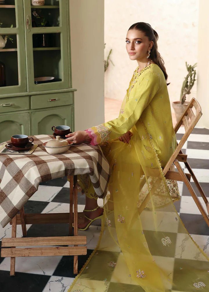 Model wearing Kanwal Malik Raha Casual Pret '24 Lucia dress in yellow, showcasing Pakistani lawn suits online in the UK.