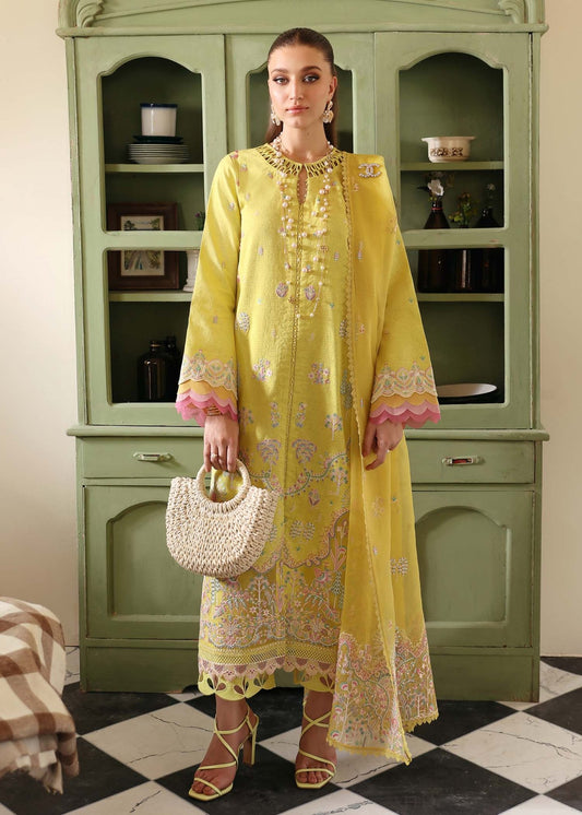 Model wearing Kanwal Malik Lucia dress in vibrant yellow, perfect for Pakistani designer clothes in UK, readymade lawn suits, stylish and elegant attire.