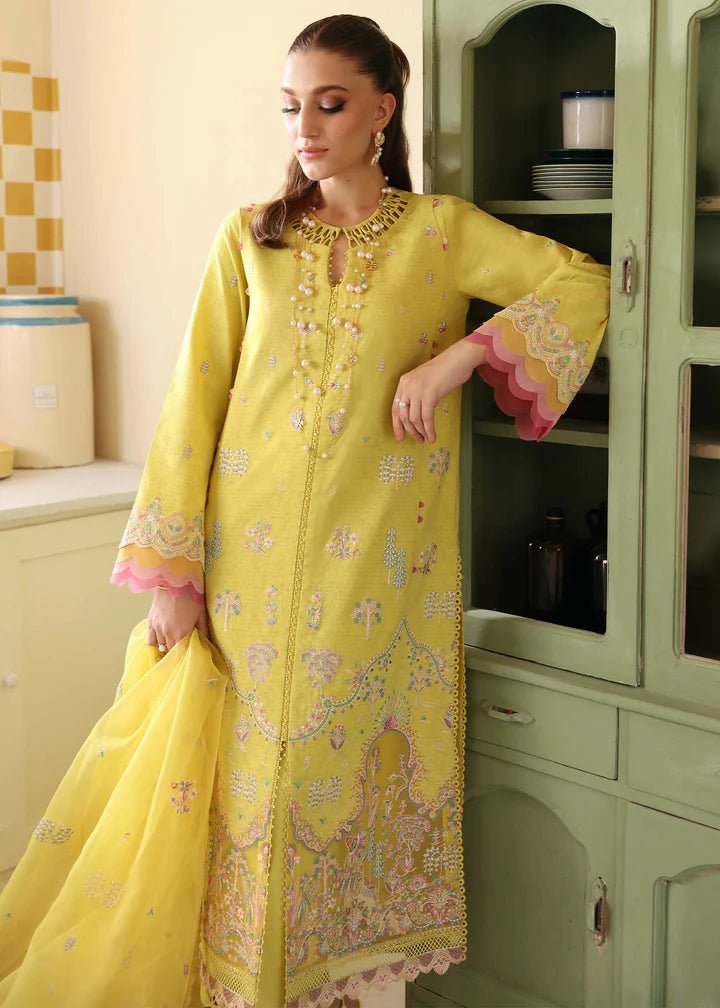 Model wearing Kanwal Malik Raha Casual Pret '24 Lucia dress in yellow, showcasing Pakistani lawn suits online in the UK.