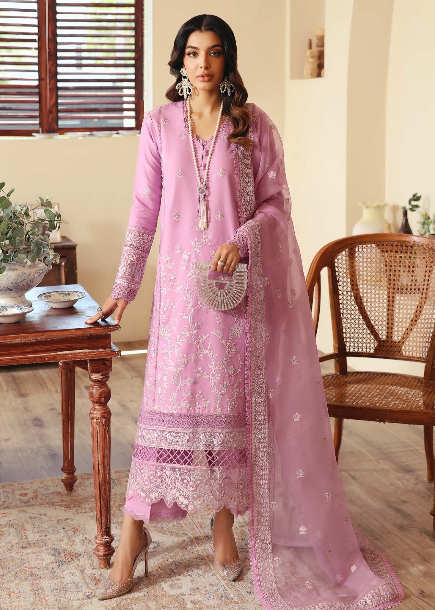 Model wearing Kanwal Malik Margot dress in soft pink, perfect for Pakistani designer clothes in UK, readymade lawn suits, showcasing elegance and style.