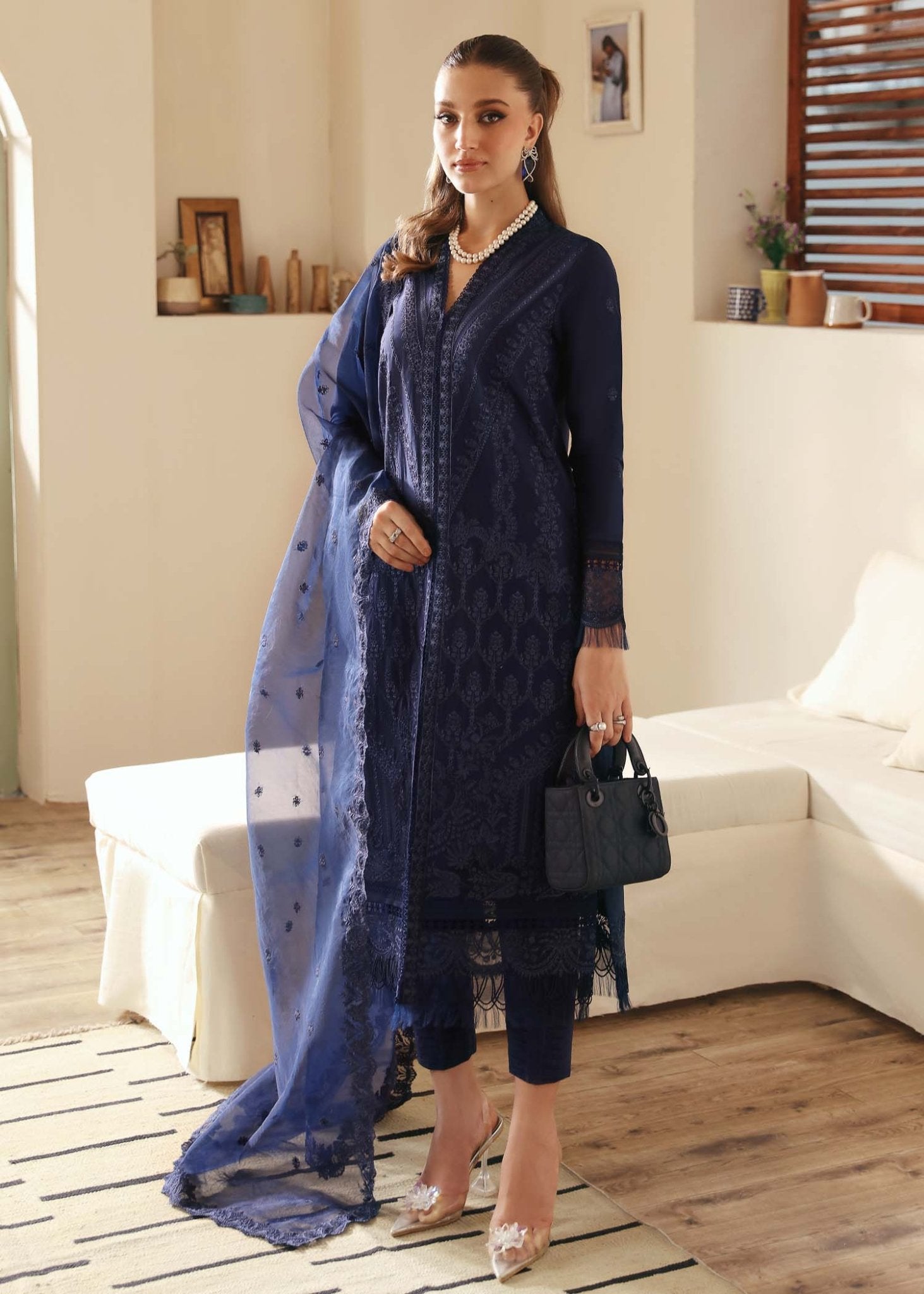 Model wearing Kanwal Malik Rachael dress in elegant navy blue, perfect for Pakistani designer clothes in UK, readymade lawn suits.