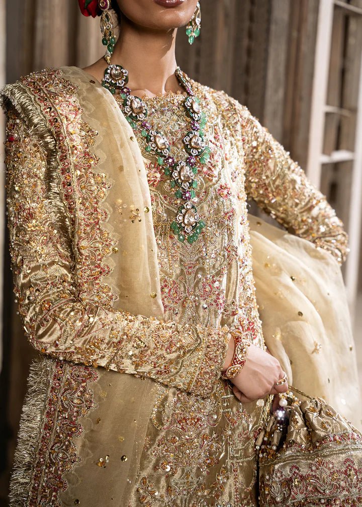 Explore Kanwal Malik's Shahnoor from the Sajni II Formal Collection, a luxurious gold ensemble featuring intricate pearl and sequin embellishments. Priced at £824. Shop Pakistani wedding clothes online in the UK at Signature Labels today!