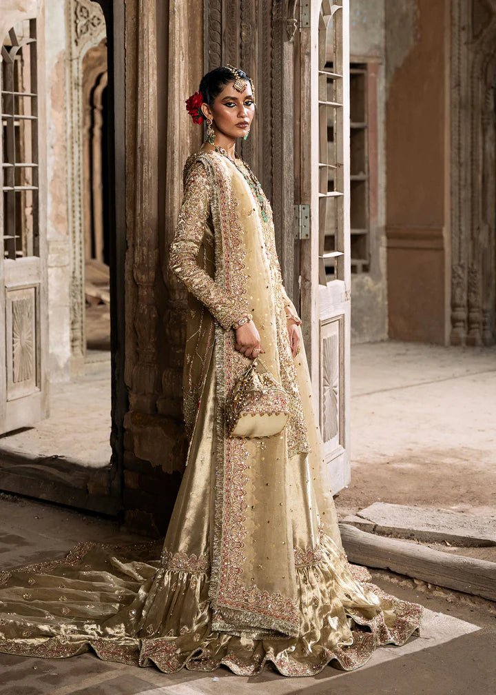 Explore Kanwal Malik's Shahnoor from the Sajni II Formal Collection, a luxurious gold ensemble featuring intricate pearl and sequin embellishments. Priced at £824. Shop Pakistani wedding clothes online in the UK at Signature Labels today!