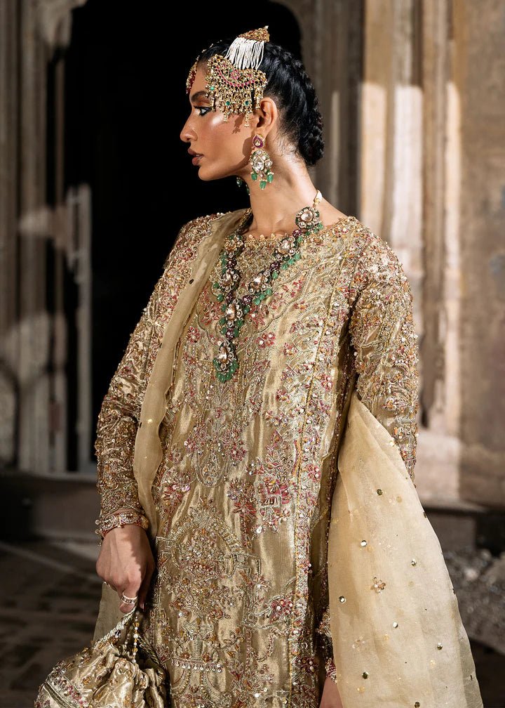 Explore Kanwal Malik's Shahnoor from the Sajni II Formal Collection, a luxurious gold ensemble featuring intricate pearl and sequin embellishments. Priced at £824. Shop Pakistani wedding clothes online in the UK at Signature Labels today!