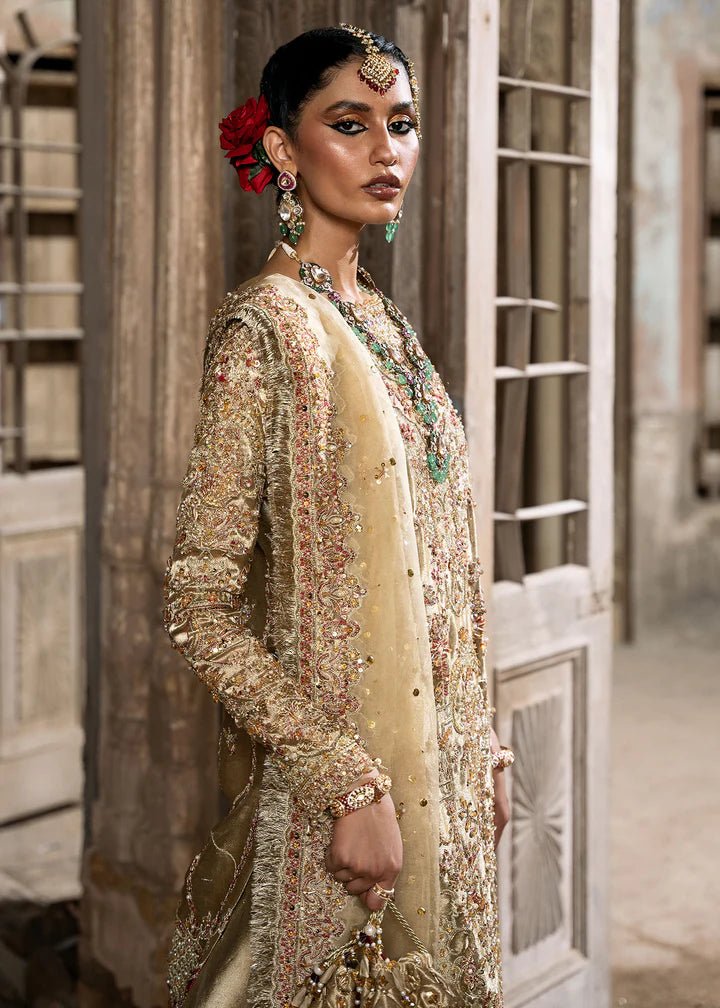 Explore Kanwal Malik's Shahnoor from the Sajni II Formal Collection, a luxurious gold ensemble featuring intricate pearl and sequin embellishments. Priced at £824. Shop Pakistani wedding clothes online in the UK at Signature Labels today!