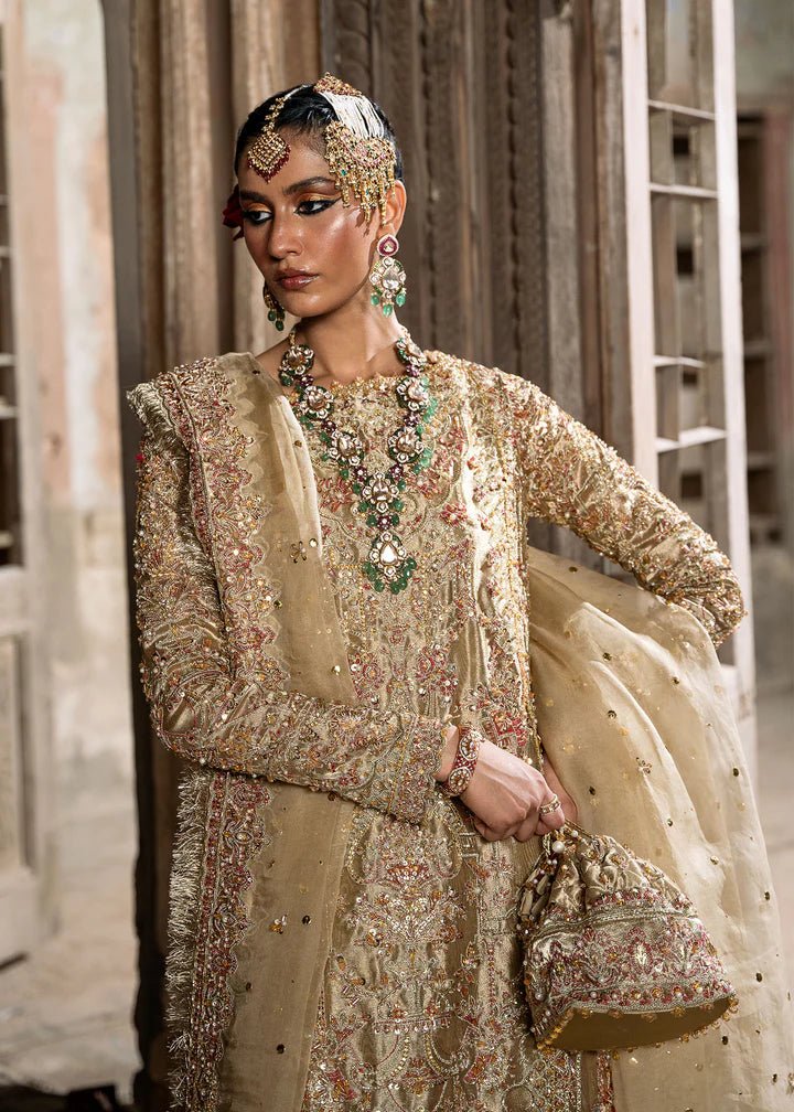 Explore Kanwal Malik's Shahnoor from the Sajni II Formal Collection, a luxurious gold ensemble featuring intricate pearl and sequin embellishments. Priced at £824. Shop Pakistani wedding clothes online in the UK at Signature Labels today!