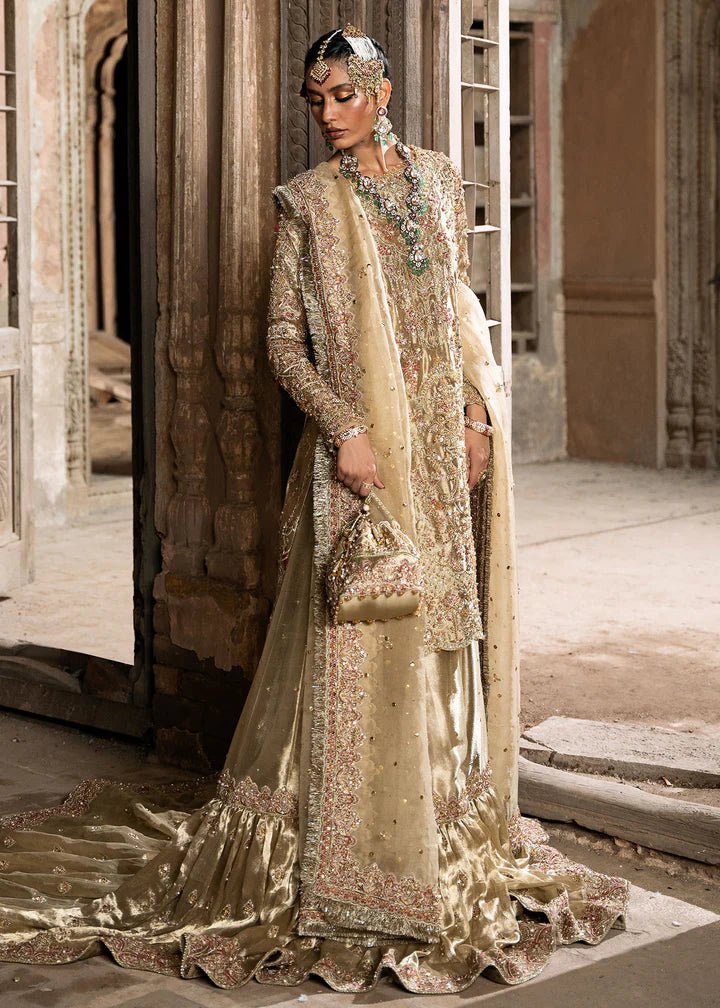 Explore Kanwal Malik's Shahnoor from the Sajni II Formal Collection, a luxurious gold ensemble featuring intricate pearl and sequin embellishments. Priced at £824. Shop Pakistani wedding clothes online in the UK at Signature Labels today!