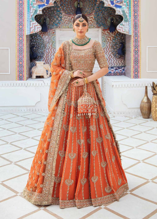 Model showcasing Kanwal Malik Vistas Of Jaipur '23 Kesar dress, enriching Pakistani wedding attire online in the UK.