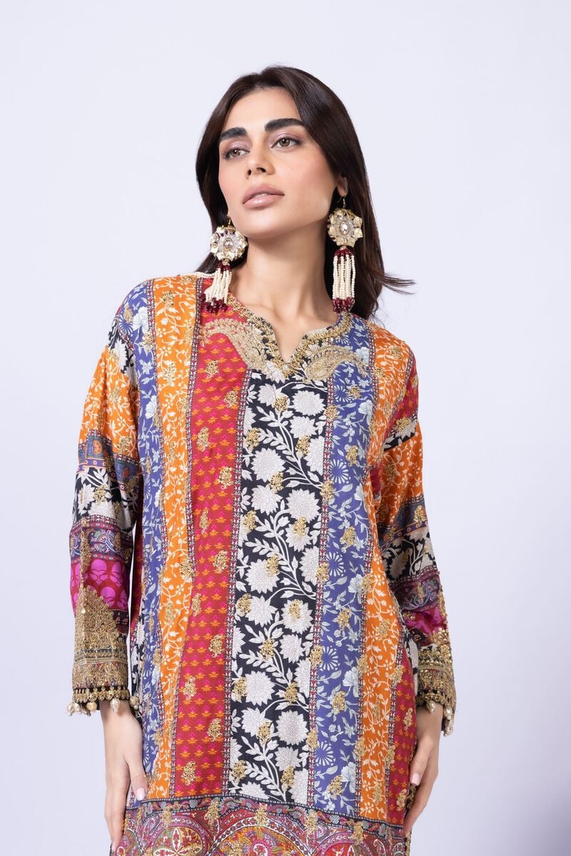 Model wearing Khaadi EST24558A multicolor dress with intricate prints and black embroidered gharara. Shop Pakistani clothes online in the UK now.