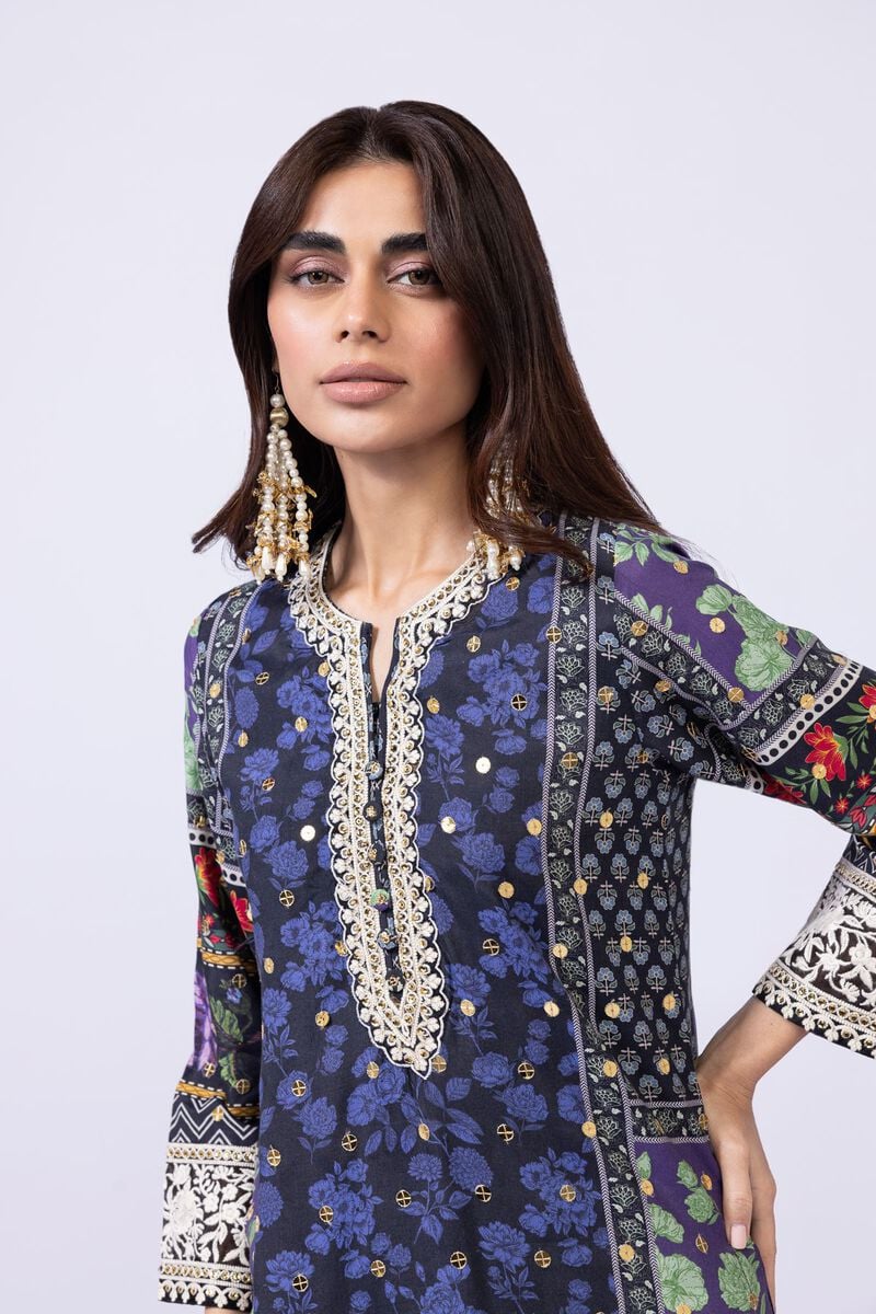 Model wearing Khaadi EST24559A navy blue dress with intricate floral and ethnic prints. Shop Pakistani clothes online in the UK now.