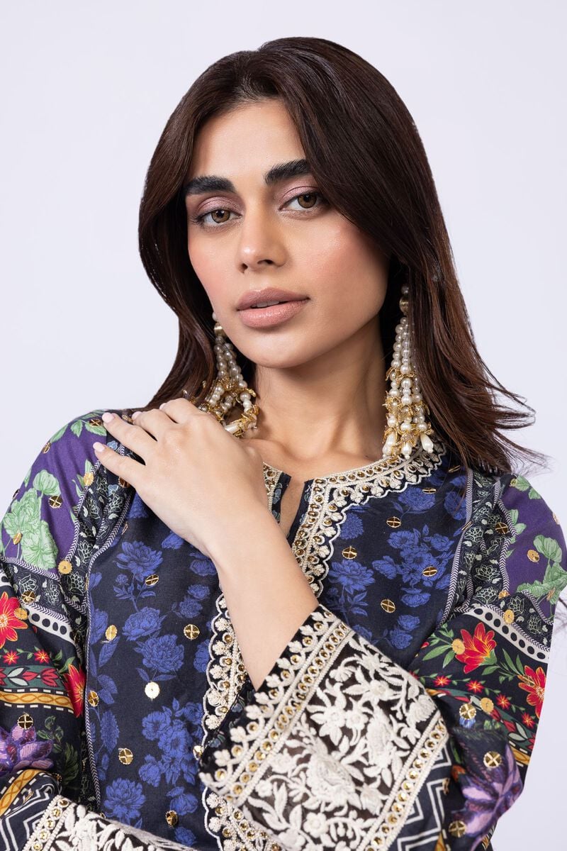 Model wearing Khaadi EST24559A navy blue dress with intricate floral and ethnic prints. Shop Pakistani clothes online in the UK now.