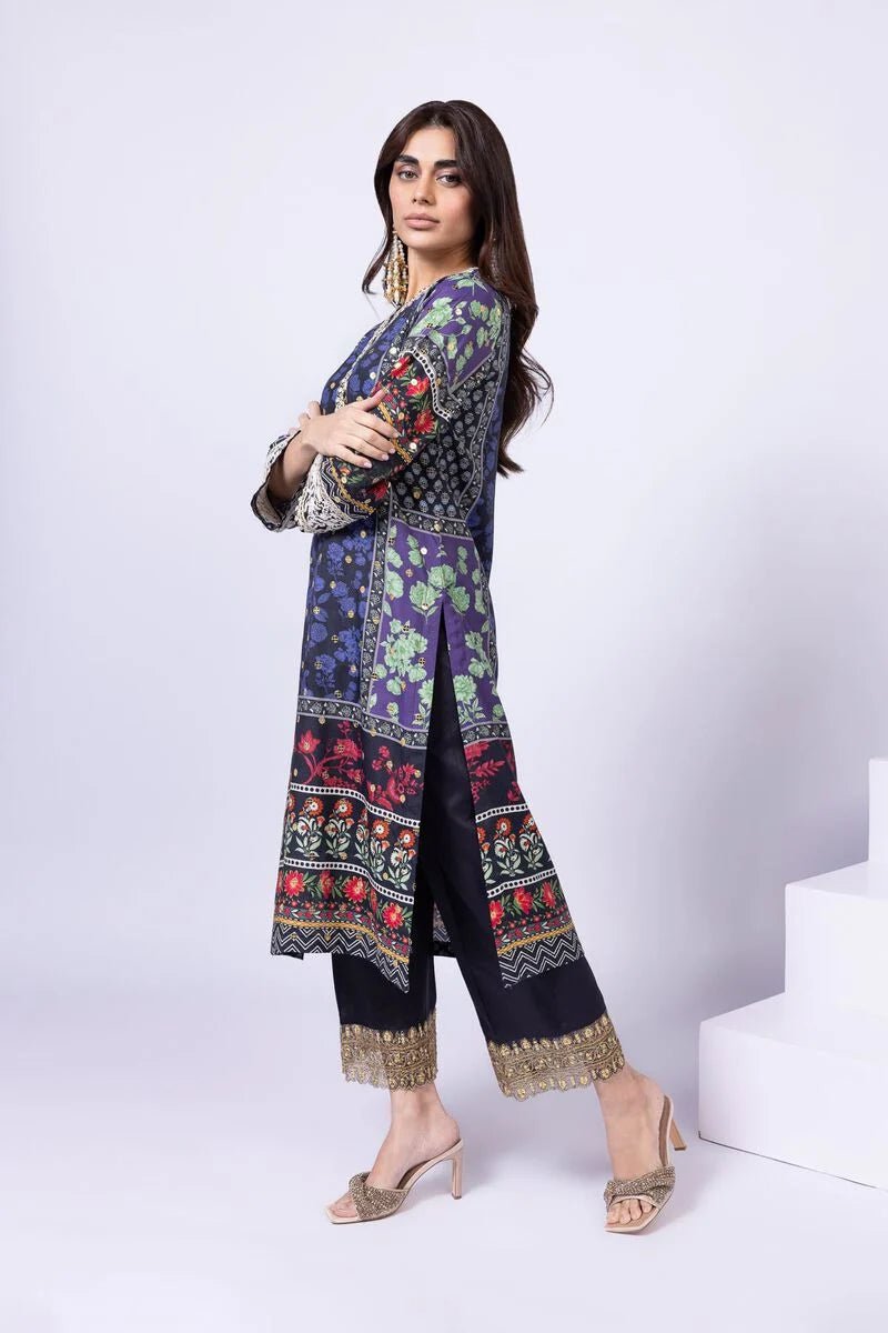 Model wearing Khaadi EST24559A navy blue dress with intricate floral and ethnic prints. Shop Pakistani clothes online in the UK now.