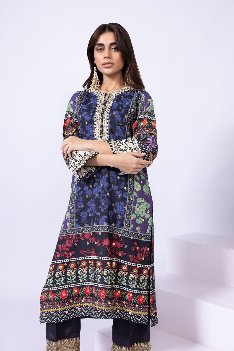 Model wearing Khaadi EST24559A navy blue dress with intricate floral and ethnic prints. Shop Pakistani clothes online in the UK now.