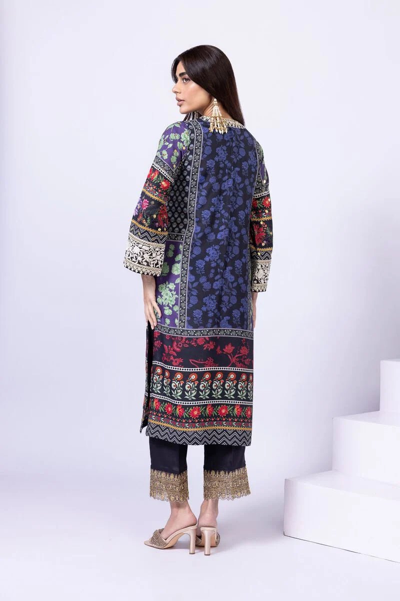 Model wearing Khaadi EST24559A navy blue dress with intricate floral and ethnic prints. Shop Pakistani clothes online in the UK now.