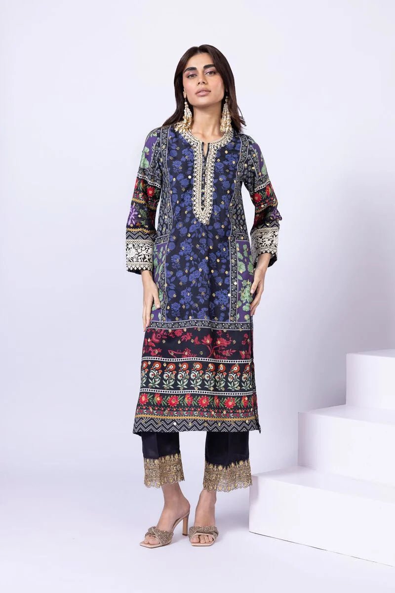 Model wearing Khaadi EST24559A navy blue dress with intricate floral and ethnic prints. Shop Pakistani clothes online in the UK now.