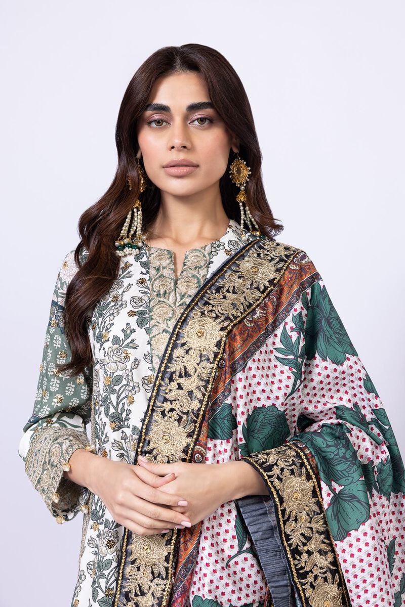 Model wearing Khaadi EST24563B off - white dress with intricate green prints and embroidered dupatta. Shop Pakistani clothes online in the UK now.