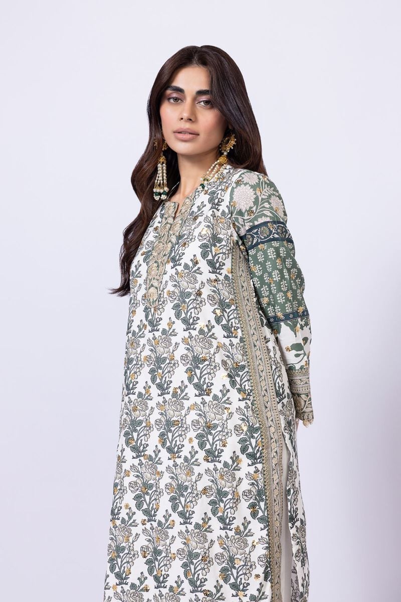 Model wearing Khaadi EST24563B off - white dress with intricate green prints and embroidered dupatta. Shop Pakistani clothes online in the UK now.