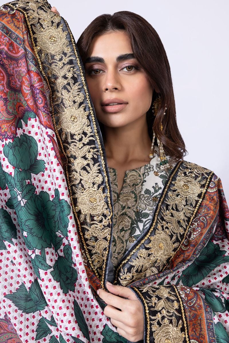 Model wearing Khaadi EST24563B off - white dress with intricate green prints and embroidered dupatta. Shop Pakistani clothes online in the UK now.