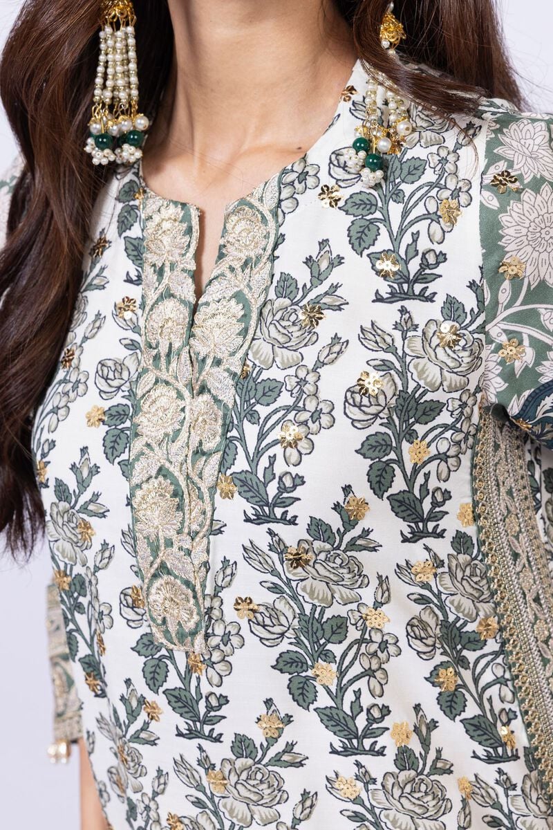 Model wearing Khaadi EST24563B off - white dress with intricate green prints and embroidered dupatta. Shop Pakistani clothes online in the UK now.