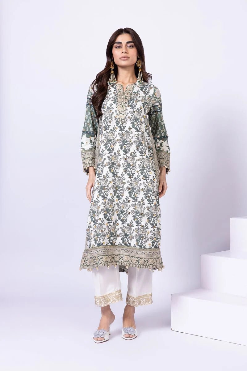 Model wearing Khaadi EST24563B off - white dress with intricate green prints and embroidered dupatta. Shop Pakistani clothes online in the UK now.