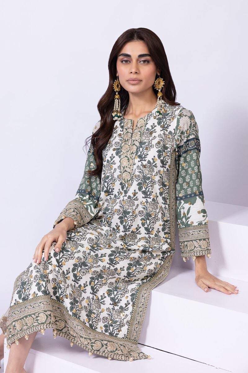 Model wearing Khaadi EST24563B off - white dress with intricate green prints and embroidered dupatta. Shop Pakistani clothes online in the UK now.