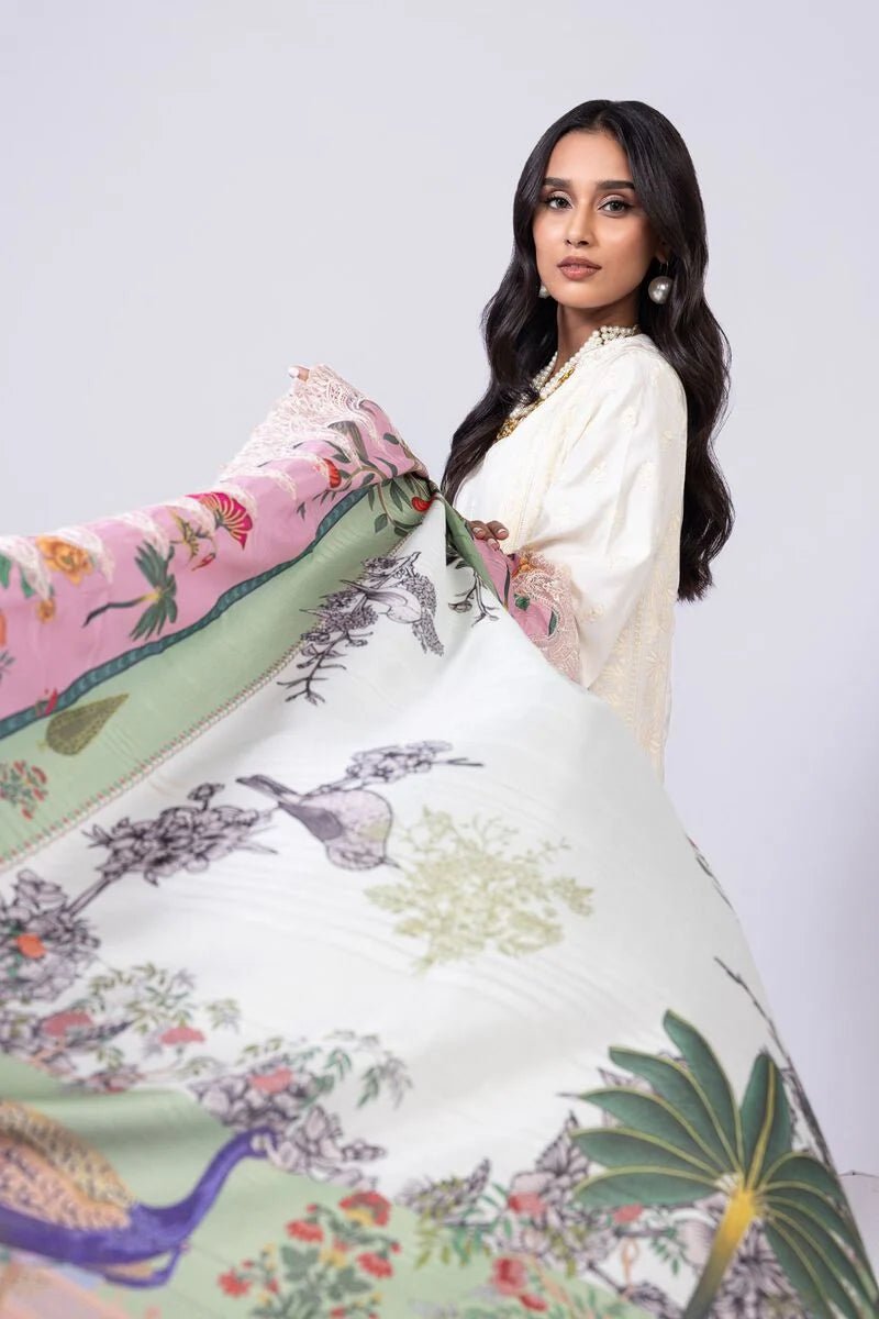 Model wearing Khaadi EST24609A off - white dress with delicate embroidery and a vibrant pink and green printed dupatta. Shop Pakistani clothes online in the UK now.